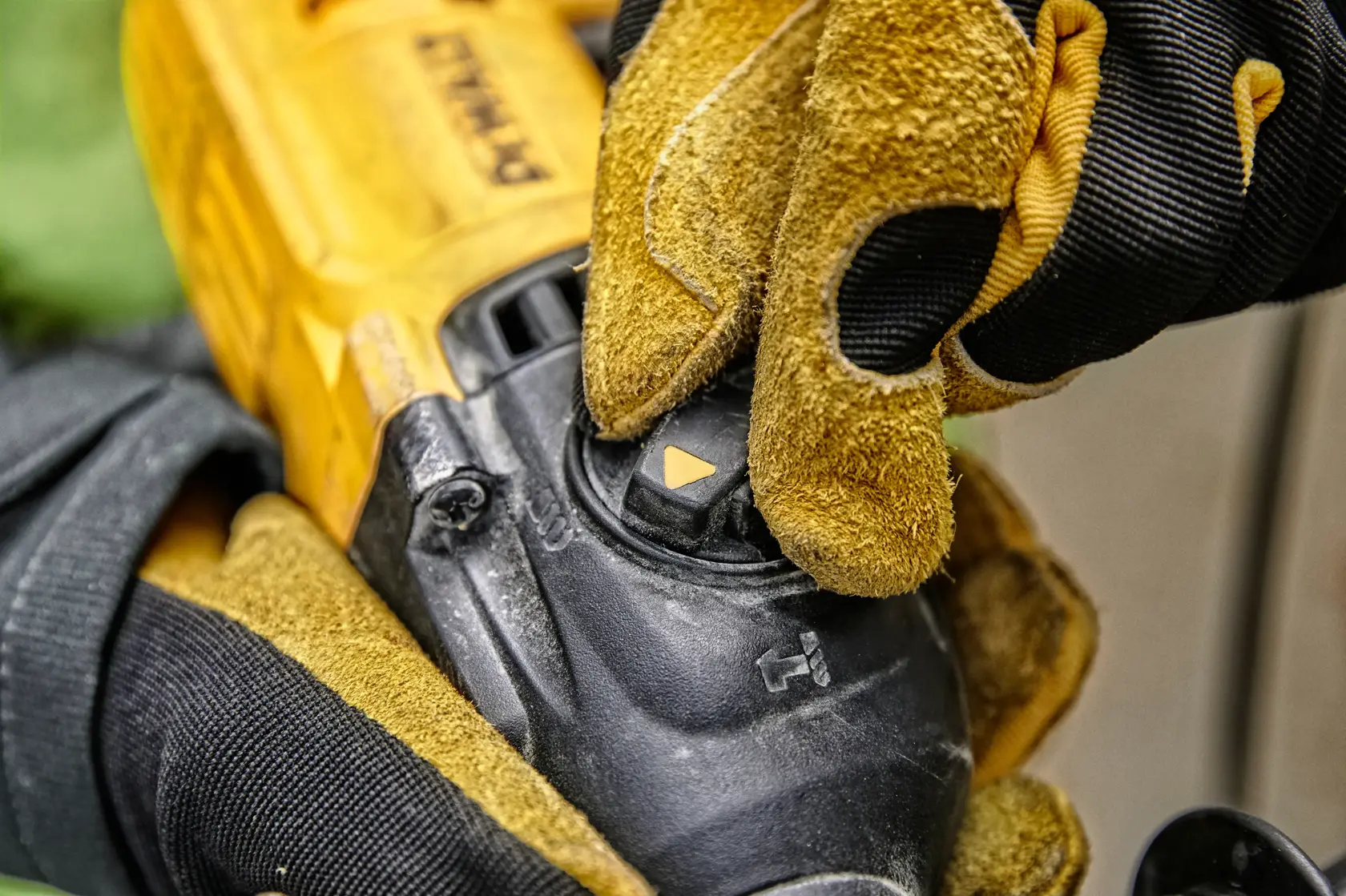 A DEWALT D25133K corded rotary hammer drill with a black and yellow design, featuring a side handle and depth gauge.